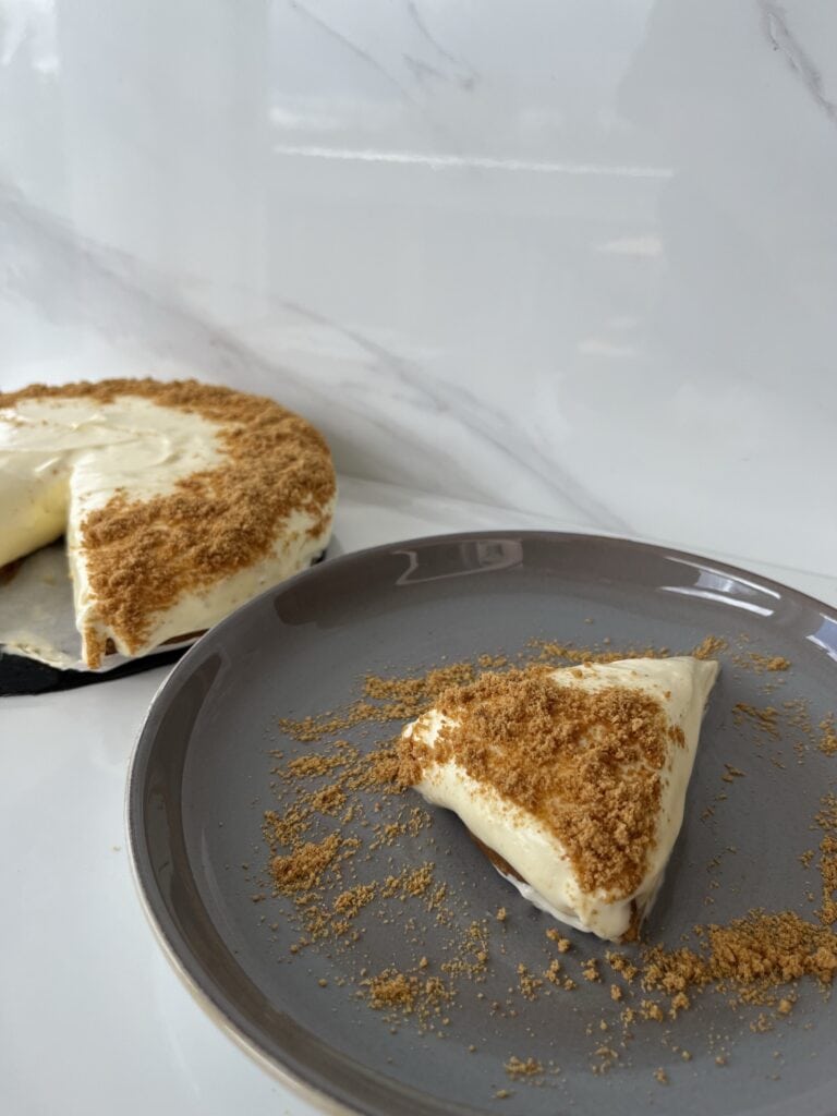 lemon lime cheesecake with ginger biscuit base and biscuit crumble on top