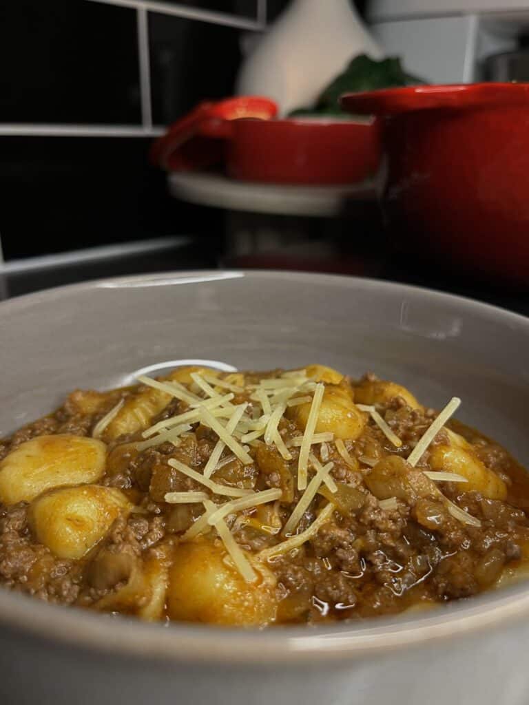 french onion gnocchi with a red wine tomato beef mince in a bowl