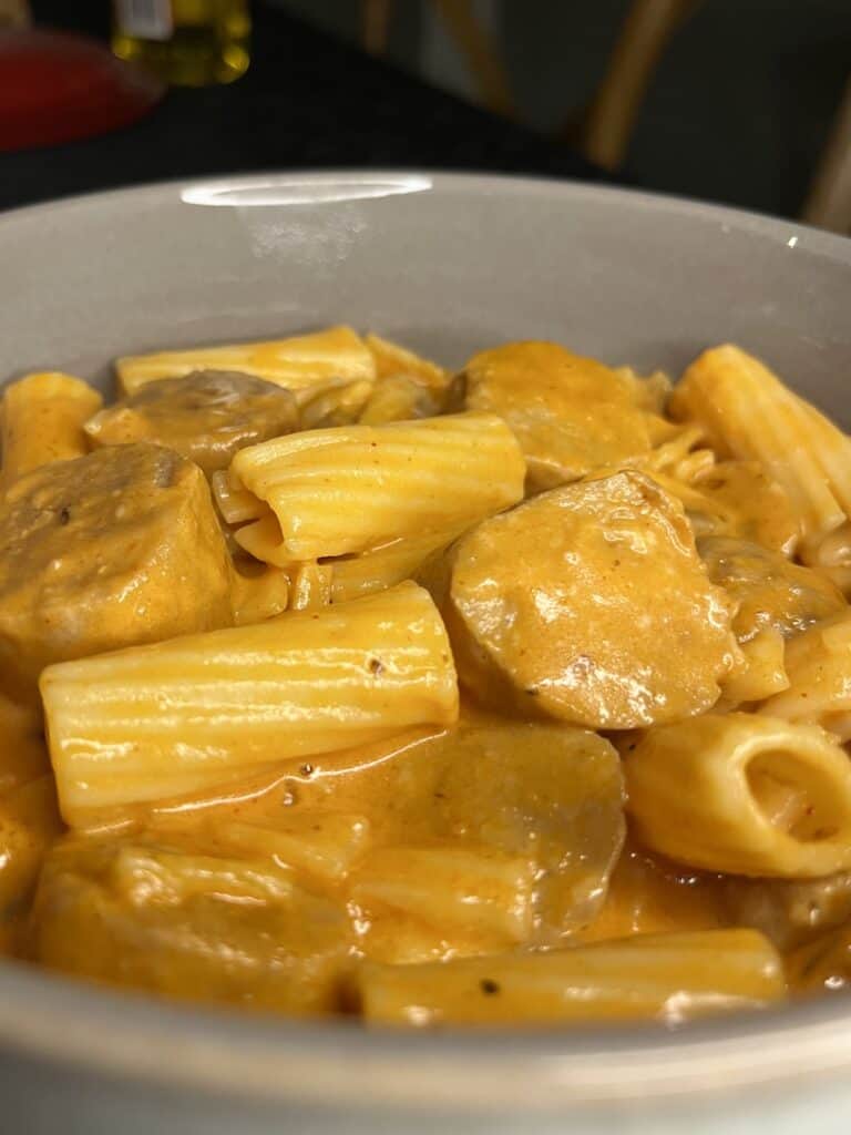 tomato sausage pasta, pork sausages in a creamy and cheesy tomato sauce with mushroom and gluten free pasta