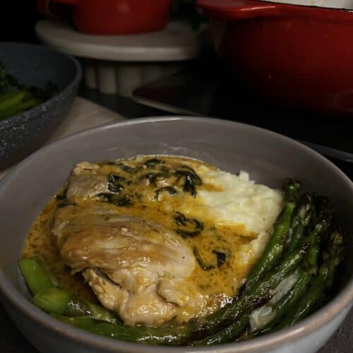 garlic parmesan chicken with cheesy mashed potatoes, chicken thighs, asparagus, and spinach