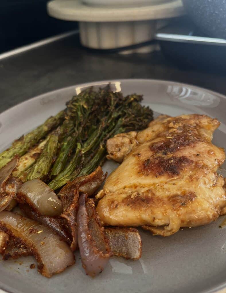 seasoned chicken thighs with roast vegetable hash, broccolini, red onion, and asparagus