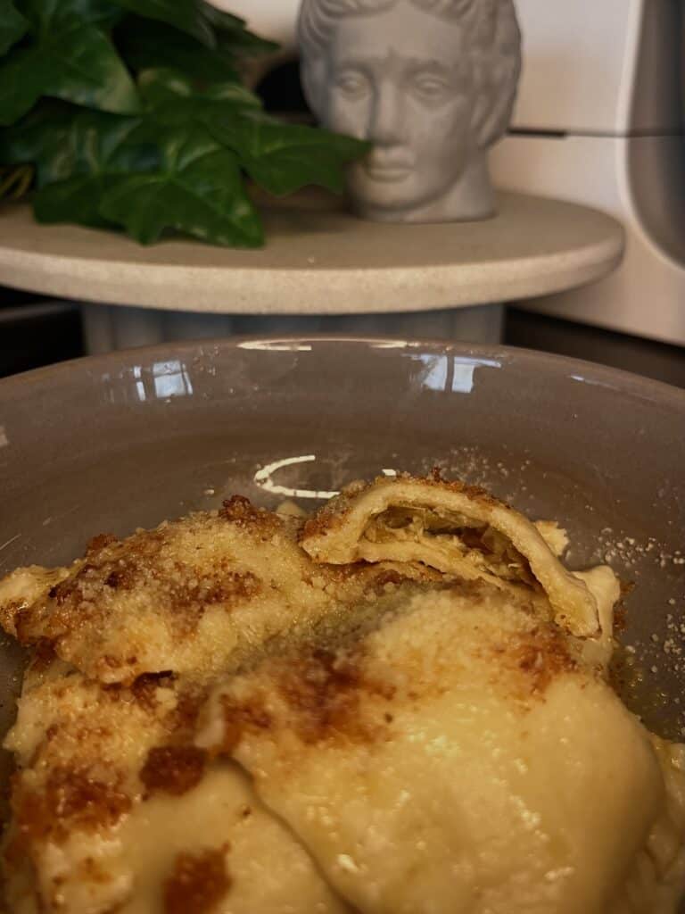 home made leek and feta ravioli pasta with brown butter sauce and parmesan