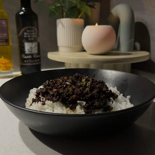 crispy beef mince, with soy sauce, oyster sauce, sesame oil, and spring onion served over white rice