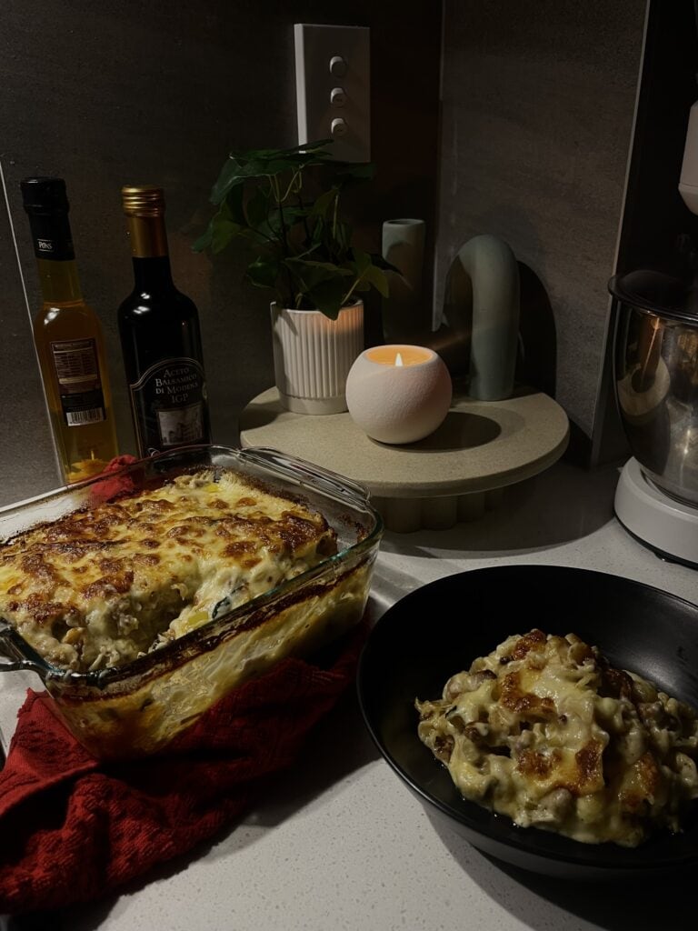 pork sausage and leek lasagna, in a parmesan cheese sauce, with spinach, topped by fresh mozzarella