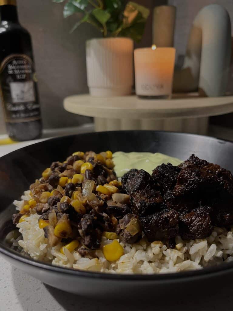 steak rice bowls with corn, black beans, mushrooms, brown rice, and seasoned charred steak